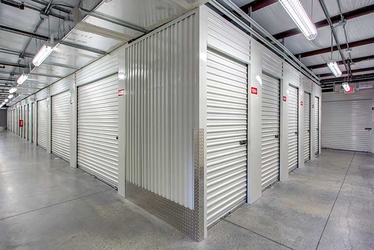 Hallway lined with self storage doors. 