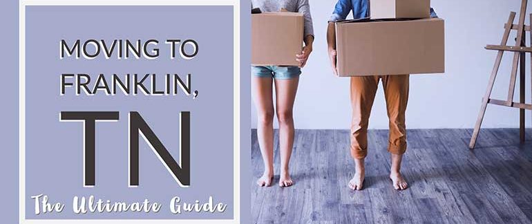 Man and woman holding moving boxes in Franklin, TN.
