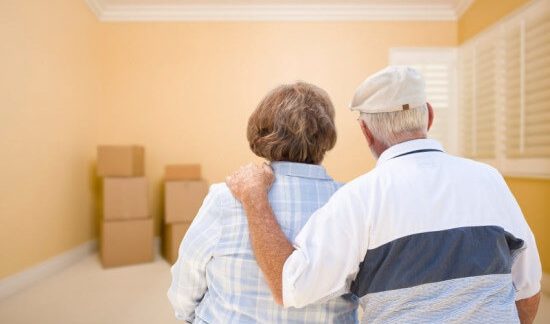 An older couple moves into a new home