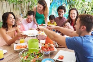 new friends sharing meal after moving with kids