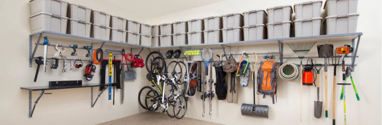 A garage equipped with shelves and other storage accomodations