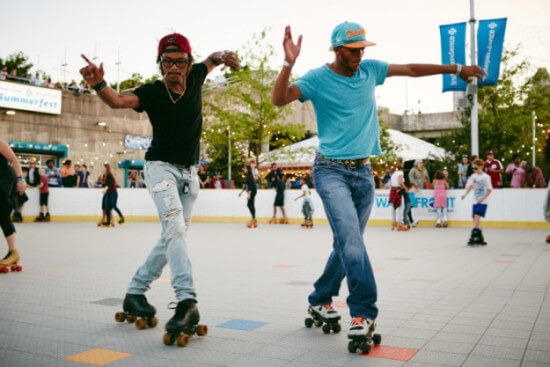 Two roller skaters roll around the Penn's Landing Delaware River Waterfront