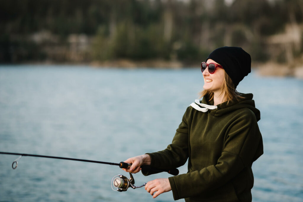 Woman fishing at the lake.
