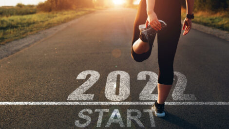 Woman stretching at 2022 starting line