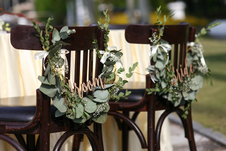Bride and groom chair decorations.