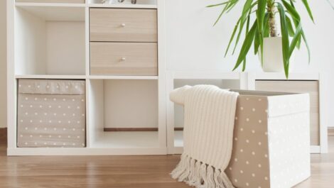 a small apartment with modular shelving units