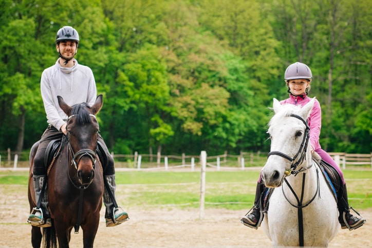 Brother and sister horseback riding in New Jersey