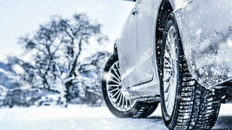 Side angle of a car driving in the snow