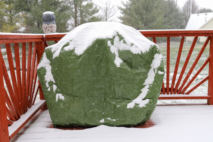 Covered grill on deck.
