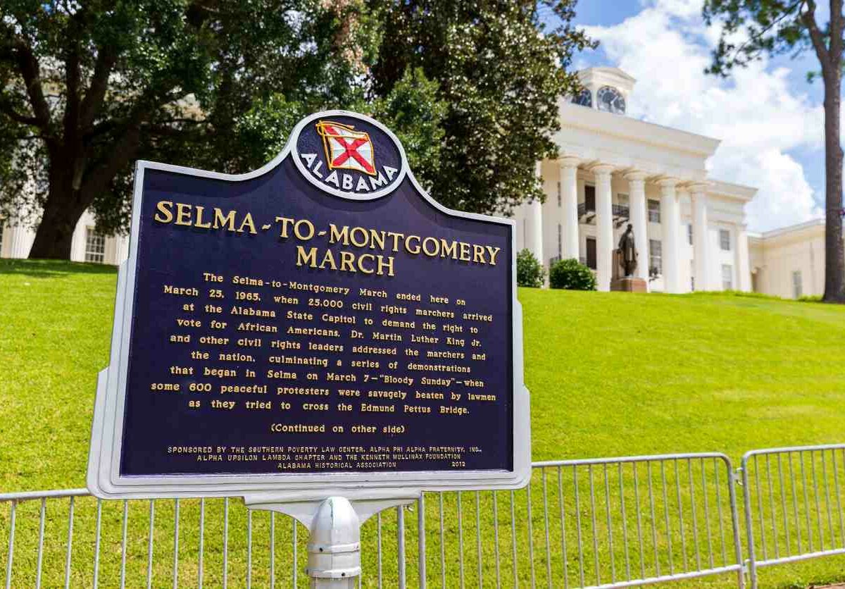 A sign in front of the Alabama State Capitol with information about the Selma-to-Montgomery March.