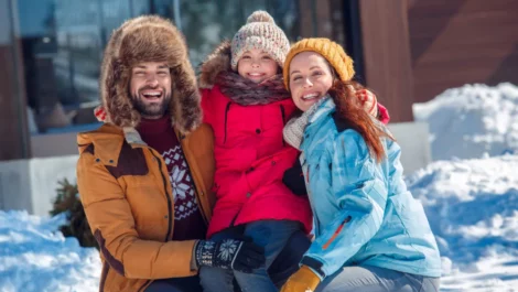 Family bundled up in winter gear for their winter move.
