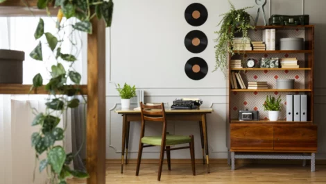 An apartment with various shelves, drawers, and a table full of items.